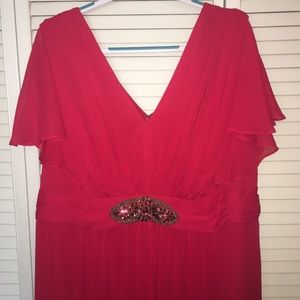Roman’s flowing red dress